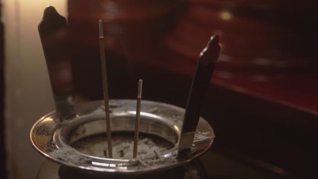 Incense burning in an incense holder used in ancestral rites