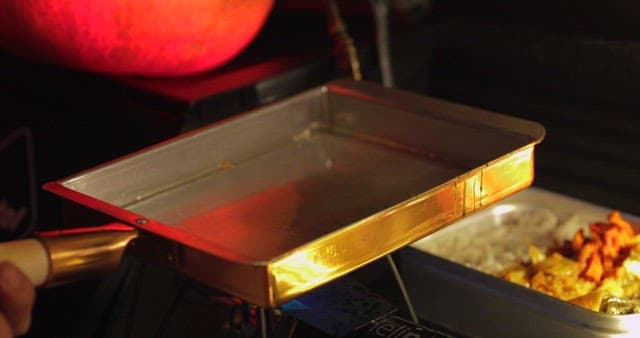 Cooking eggs on an outdoor portable stove