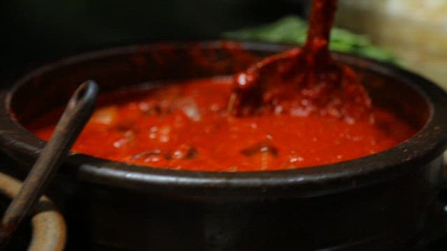 Spicy Sauce Poured over Neatly Prepared Noodles