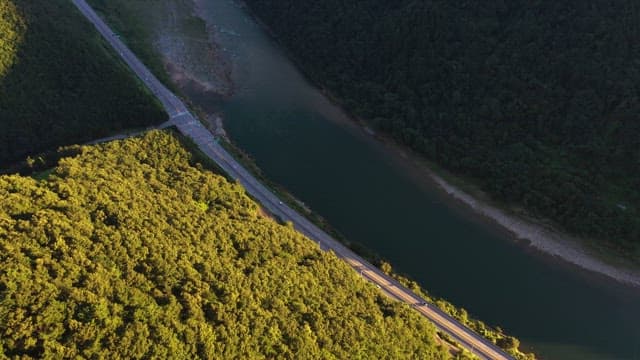 Aerial View of Highway by the River in Forest