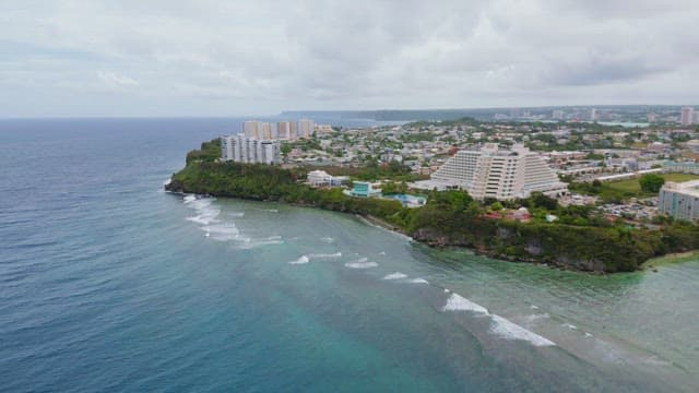 Coastal city with clear blue ocean