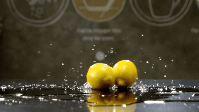 Lemons rolling over a shiny surface