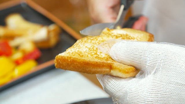 Crispy toast with yellow romesco sauce