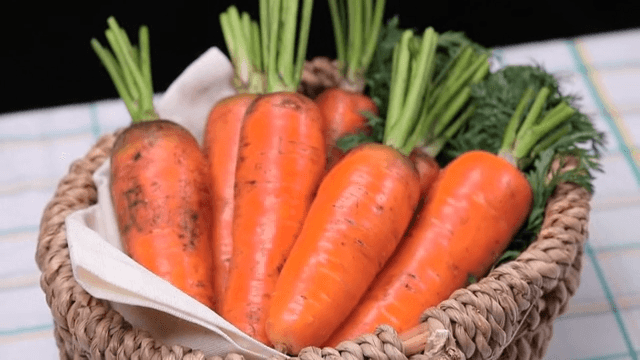 Fresh carrots in a woven basket