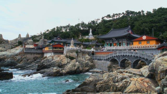 Haedong Yonggungsa Temple, a popular tourist destination located on a coastal rock cliff