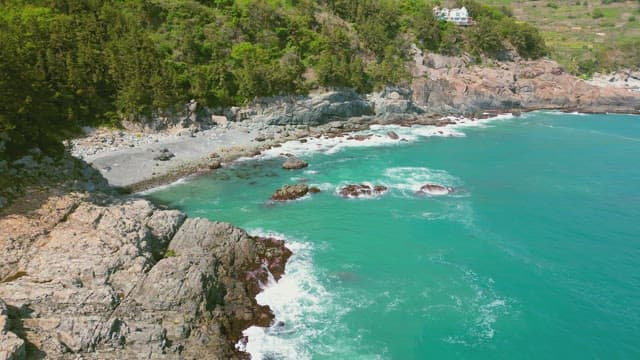 Rocky coastline with turquoise waves