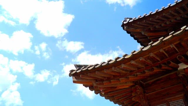 Traditional Korean architecture under a clear sky