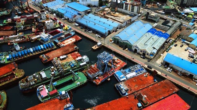 Aerial View of Industrial Port with Ships