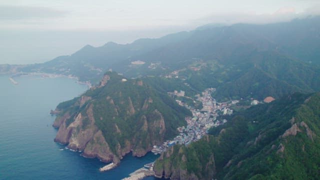 Coastal town nestled between mountains