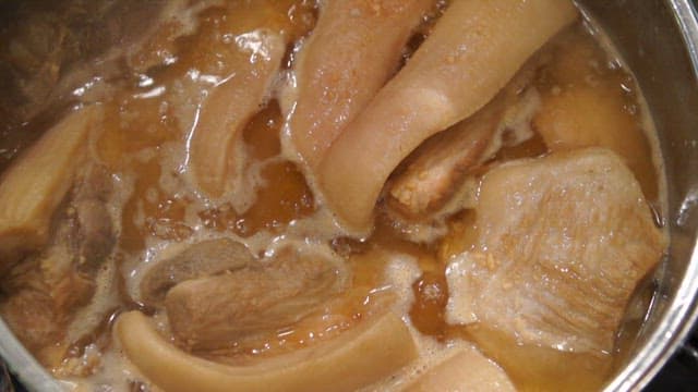 Pork belly simmering in a pot