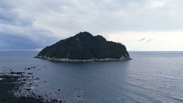 Solitary island surrounded by the sea