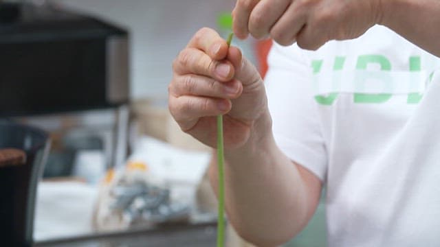 Peeling green sweet potato stem