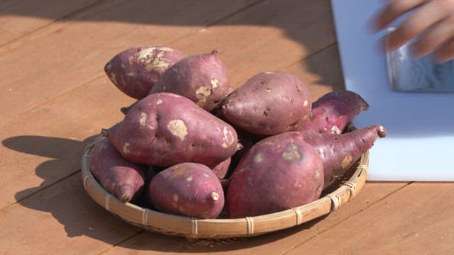 Sweet potatoes on a wooden table