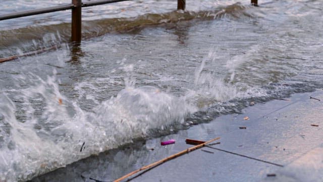 River overflowing beyond the fence