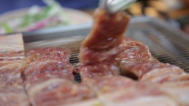 Grilled Pork Ribs Sizzling on a Grill