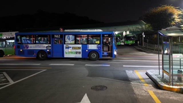 Nighttime at a Quiet City Bus Stop