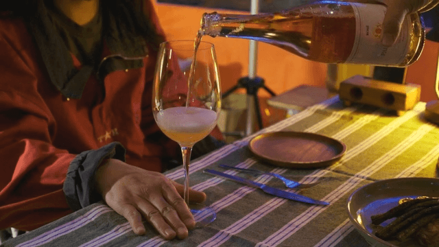 Sparkling wine prepared in a wine glass on a cozy table