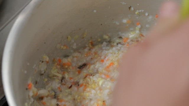 Warm, savory porridge being stirred into a bowl