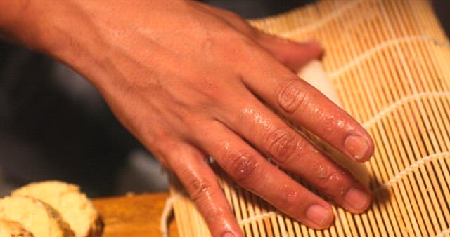 Preparing Grated Dish on Bamboo Mat