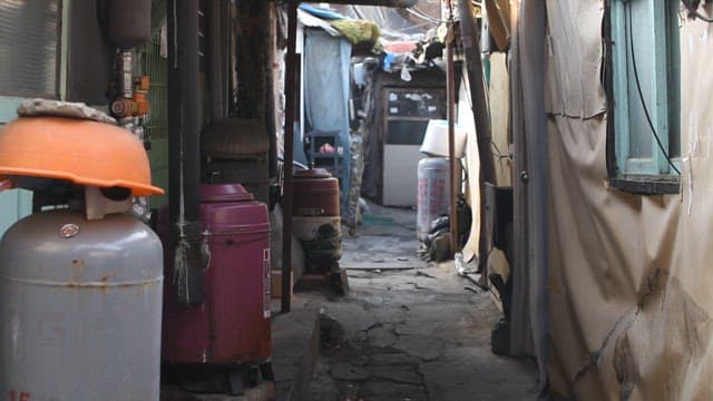 Narrow Alley Between Old Residential Buildings