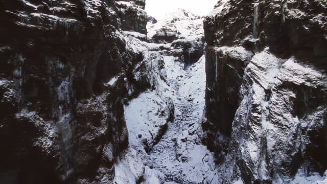 Snow-covered canyon with rugged cliffs