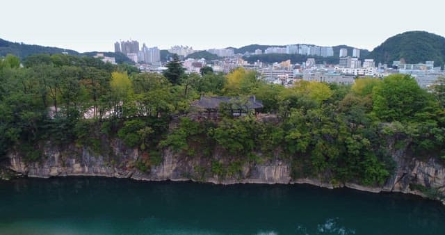 Traditional Korean Pavilion on a Cliff in Harmony with the City