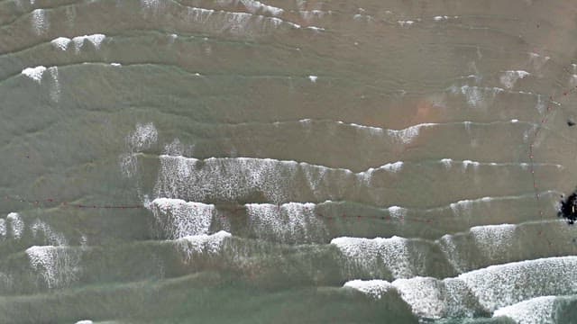 Waves gently rolling onto the shore