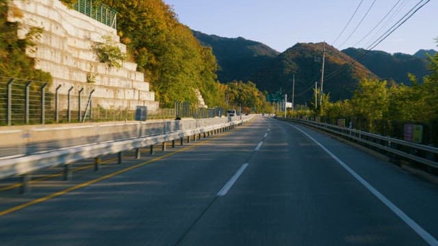 Driving through mountains on a sunny day