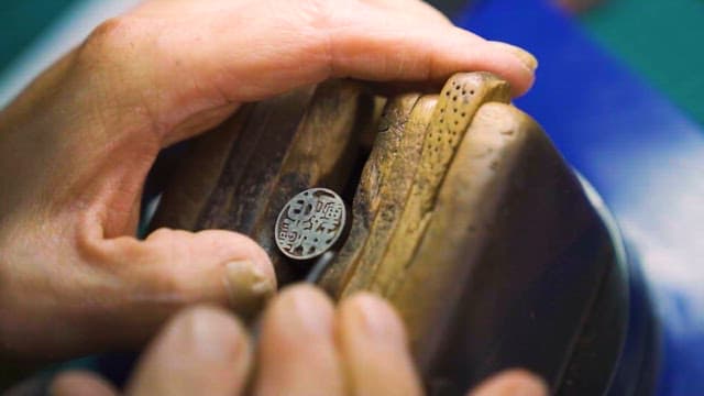 Craftsman Hand Carving a Wooden Piece