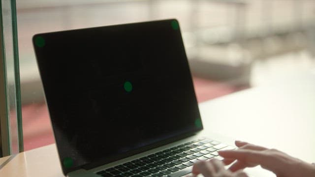 Hands Typing on a Laptop