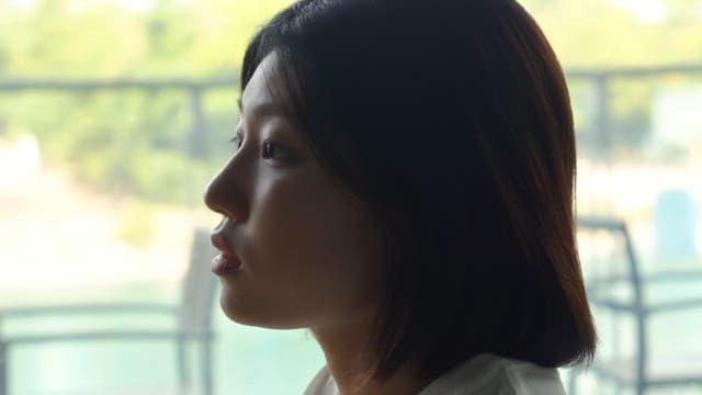 Woman relaxing with a drink at a cafe