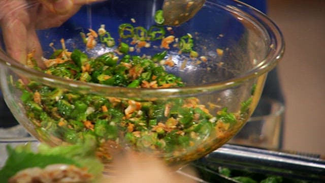 Wrap made with fresh vegetables and a spicy seasoning containing chili peppers