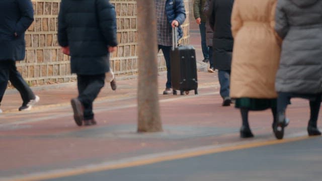 People walking on a sidewalk