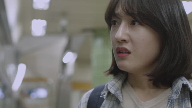 Angry woman with tears in a subway station