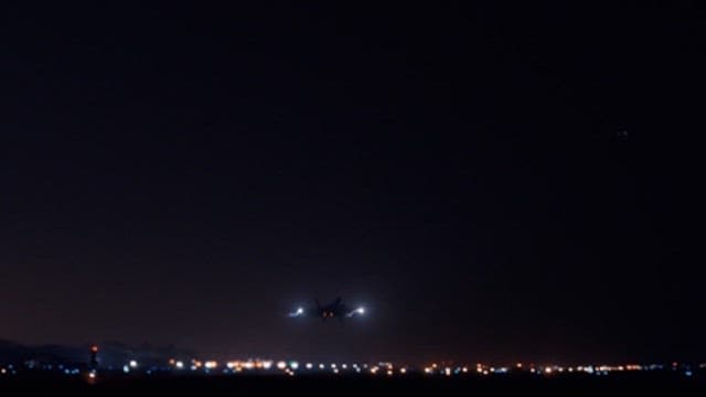 Airplane taking off at night airport