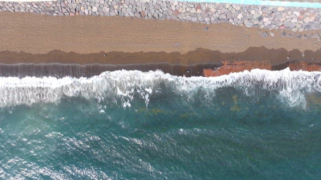 Waves crashing on a sandy beach