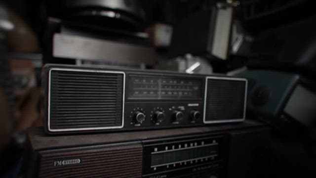 Vintage Radio Amidst Old Electronics