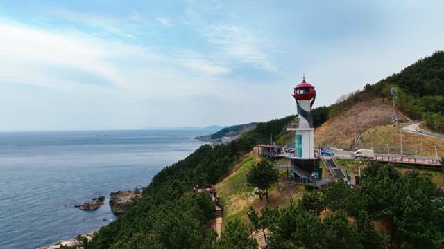 Lighthouse on a coastal hillside