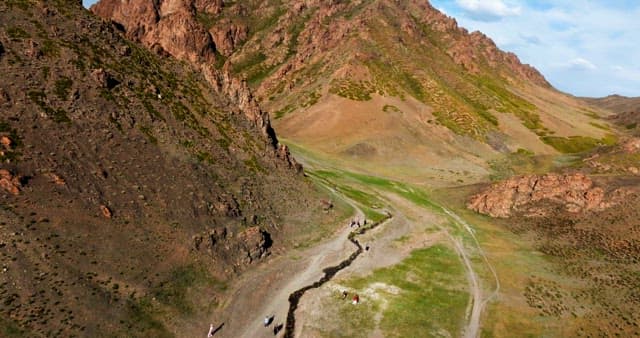 Vast mountain landscape with a trail