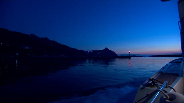 Serene Twilight Coastline from a Boat