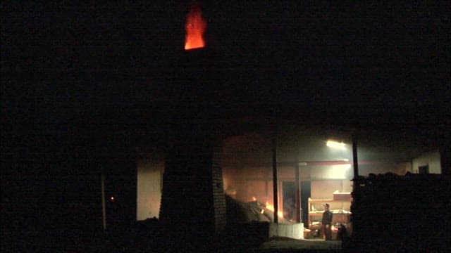 Foundry Workers Laboring in a Dark Workshop