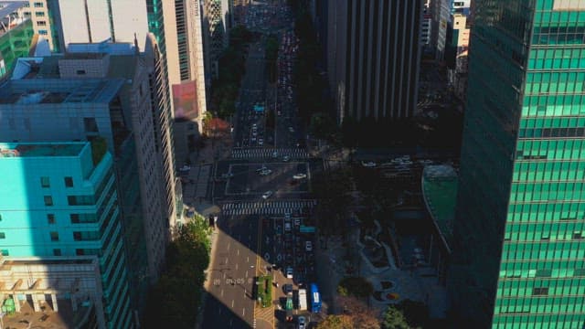 Busy city intersection with tall buildings