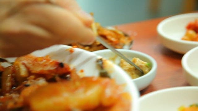 Preparing Korean ssam with side dishes