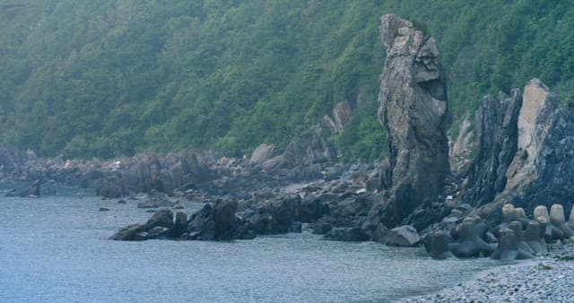 Calm Coastline with Steep Rocky Outcroppings