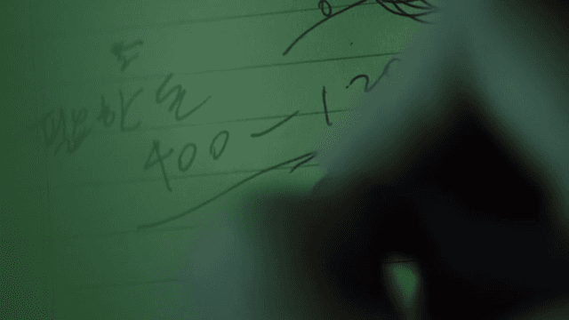 Making a note with a pen in a notebook