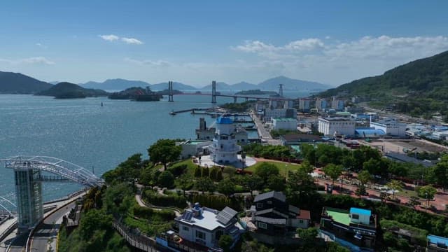 Coastal area with industrial complex and bridge