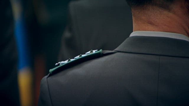 Solemn back of a military officer