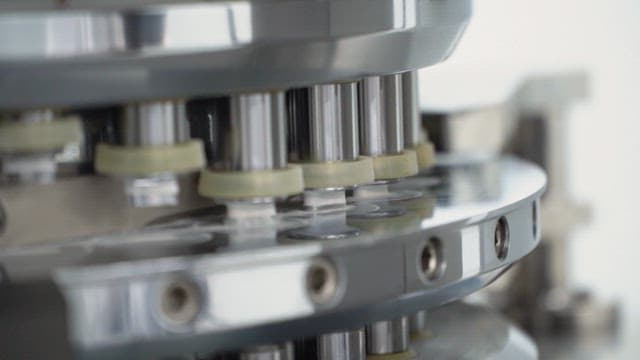 Machine operating in a factory producing pills