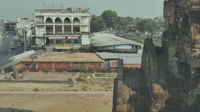 Deserted Street with an Old, Dilapidated Building and Ancient Ruins