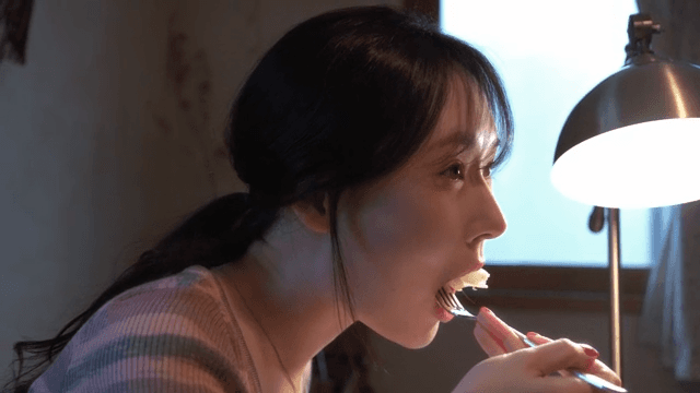 Woman enjoying a meal indoors